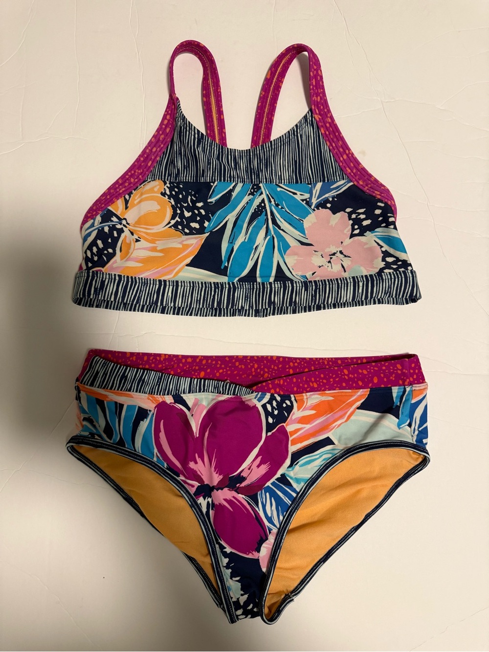 Athleta Girls Floral Two-Piece Swim Set in Magenta, Navy, Teal, Yellow